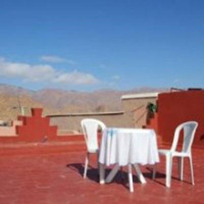 a table and chairs sitting on top of a roof at Maison D'Hote Arganino in Tafraoute