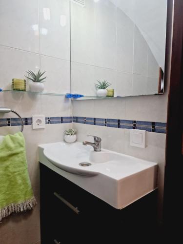 a bathroom with a sink and a mirror at CASA Gayuba in Peniscola