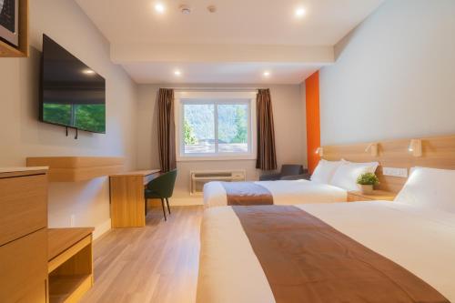 Postel nebo postele na pokoji v ubytování InnTowne Motel II