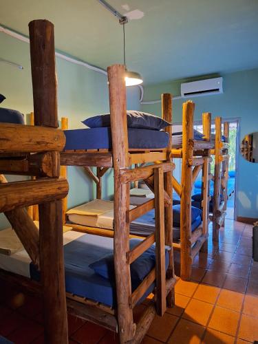 a group of bunk beds in a room at Down The River Hostel in Iporanga
