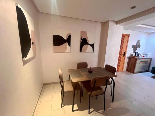 a dining room with a table and chairs at Zen & Welcoming CFC - Garage & Tramway in Casablanca