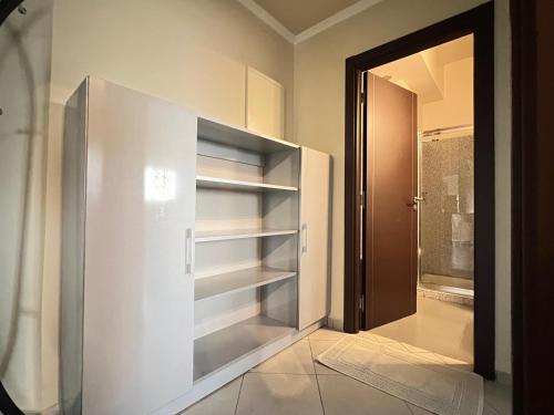 a walk in closet with a large glass door at Sweet Jacob's City Center in Agadir