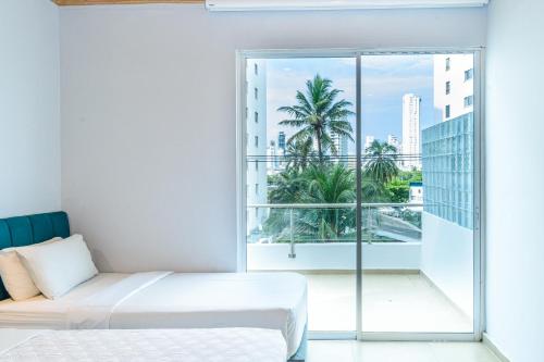 Postel nebo postele na pokoji v ubytování Hotel Caribbean Cartagena