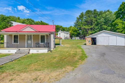 an old house with a red roof and a driveway at Cozy Tazewell Home with Grill on Back of the Dragon! in Tazewell