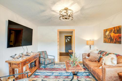 a living room with a couch and a tv at Northwood Tours Escape with Boat Dock Access! in Minocqua