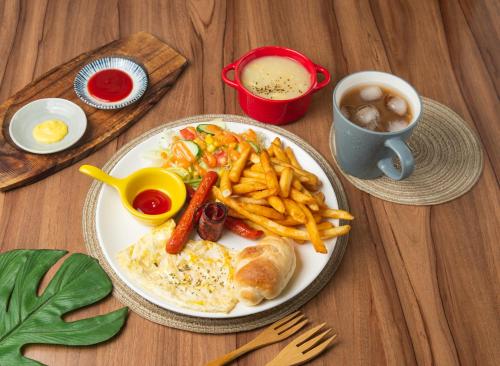 a plate of food with eggs and french fries on a table at 在路上 in Lugang