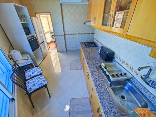 an overhead view of a kitchen with a sink at Appartement plus que parfait in Tangier
