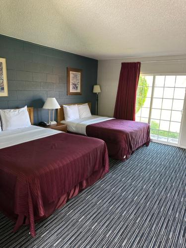 Ένα ή περισσότερα κρεβάτια σε δωμάτιο στο Relax Inn Yreka