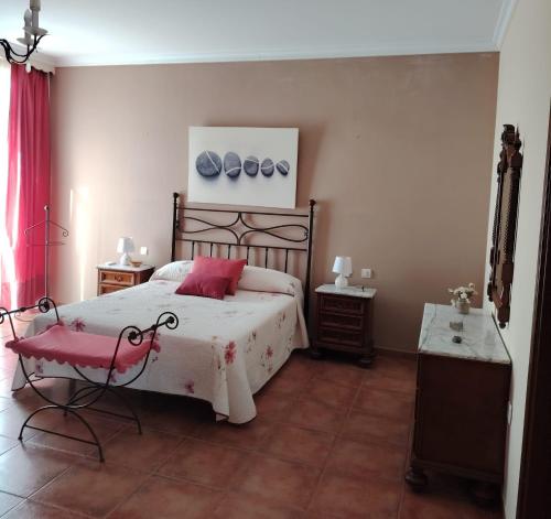 En eller flere senge i et værelse på Villa Santa Ana