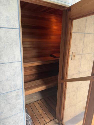 a sauna is shown with a wooden wall at Beachfront Paradise Ishigaki in Ishigaki Island