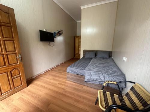 Кровать или кровати в номере Sapa Paradise Homestay