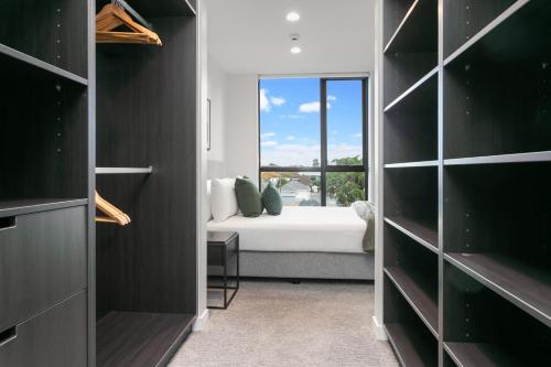 Ένα ή περισσότερα κρεβάτια σε δωμάτιο στο Urban Rest Sylvia Park Apartments