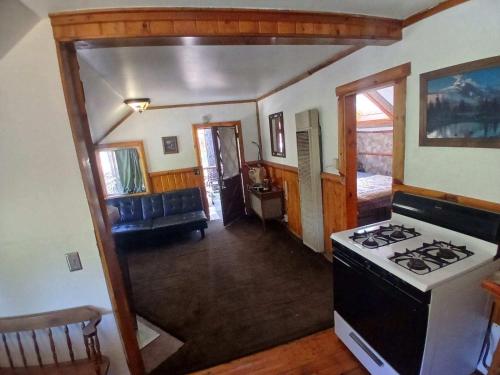 a view of a kitchen with a stove top oven at Big Bear Lake - Tulip Lane Cabin #22 in Big Bear Lake