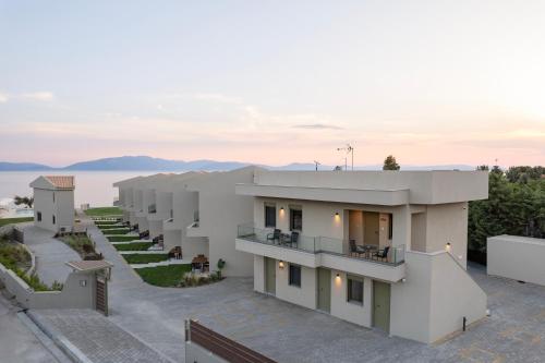 a building with a view of the water at SeaSide Village in Politiká