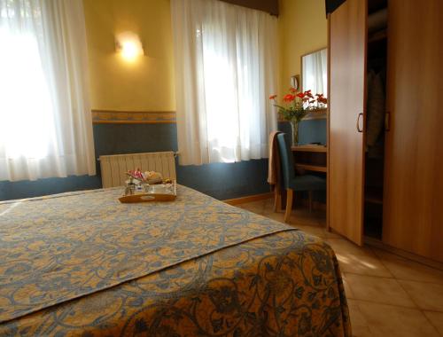 a hotel room with a bed with a tray on it at Antica Villa Graziella Venice - Atika & Atif in Marghera