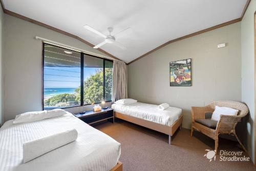 a hotel room with two beds and a window at Mintee 4 by Discover Stradbroke in Point Lookout