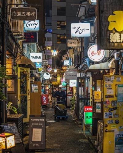 an alley with many signs in a city at night at 台東区浅草もすぐ,最大10名貸切3階建て,スカイツリーまで徒歩10分,全室Chromecast完備,WonderfulStayTOKYO SKYTREE in Tokyo