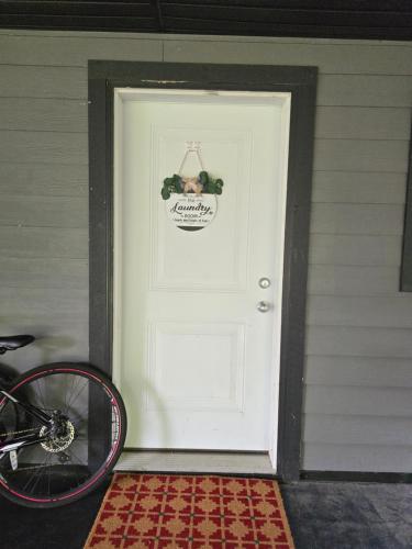 a white door with a wreath on it at Private 1 bedroom in Brookswood in Langley