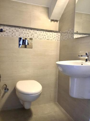 a bathroom with a toilet and a sink at ViaVia Boutique Hotel - Kathmandu in Kathmandu