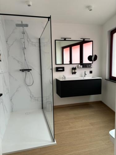 a bathroom with a shower and a sink at Comic Art Hotel in Ghent