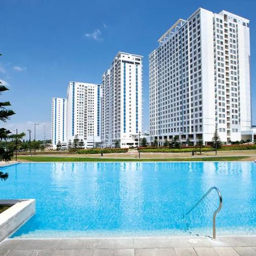 a large swimming pool in front of tall buildings at Cagayan De Oro house in Cagayan de Oro