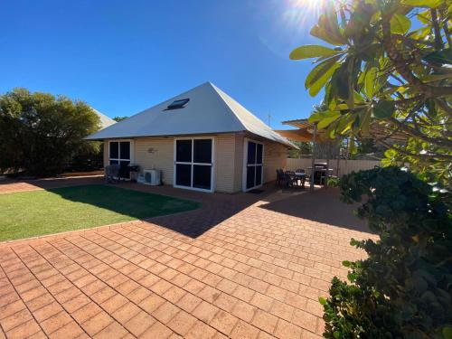 a house with a brick driveway in front of it at Osprey Holiday Village Unit 103 2 Bedroom in Exmouth
