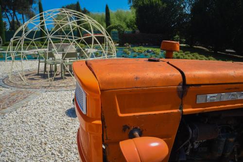 an orange machine in front of a playground at Casale al Foino in Induno Olona