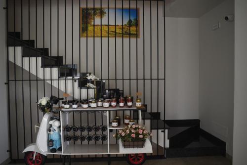 a food cart in a hallway next to a staircase at Casale al Foino in Induno Olona