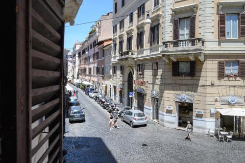 a group of people walking down a city street at GuestHouse o Affittacamere Magenta Baylon Suite in Rome