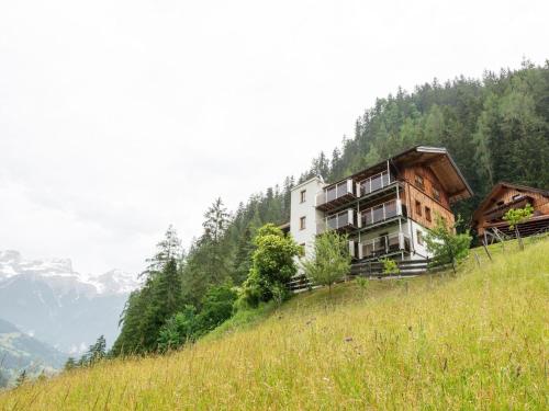 a building on the side of a hill at Farmhouse in Tobadill with Mountain Views in Tobadill