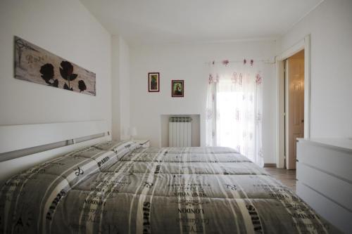 Postel nebo postele na pokoji v ubytování L'Attico
