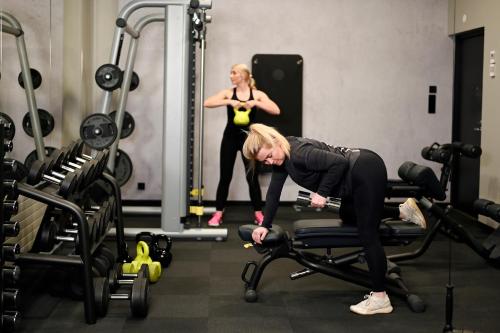 two women working out in a gym at Original Sokos Hotel Vaakuna Kouvola in Kouvola