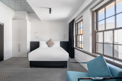 Ένα ή περισσότερα κρεβάτια σε δωμάτιο στο Peppers Gallery Hotel