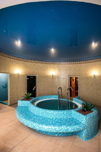 a large pool of water in a room with at Hotel Golden Palace in Göd
