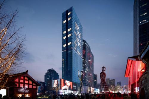 a group of tall buildings in a city at night at ISEYA Serviced Apart-ment Chengdu Taikoo Li Flagship in Chengdu