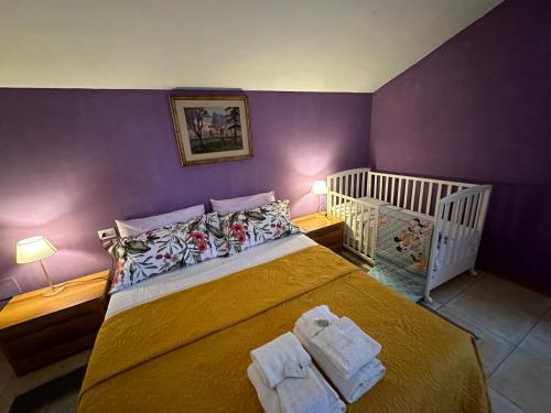a bedroom with a bed with two towels on it at Casa vacanze Giuliani via Rasiglia in Casenove