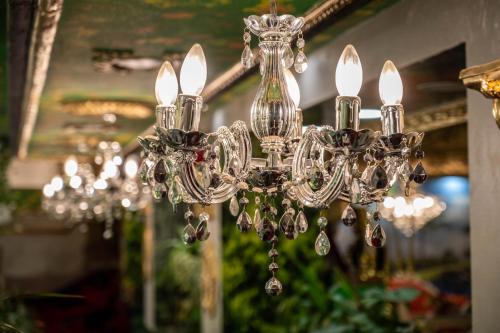 a silver chandelier hanging from a ceiling at Aparthotel AA in Sarajevo
