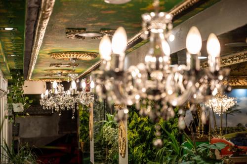 a chandelier hanging from a ceiling in a room at Aparthotel AA in Sarajevo