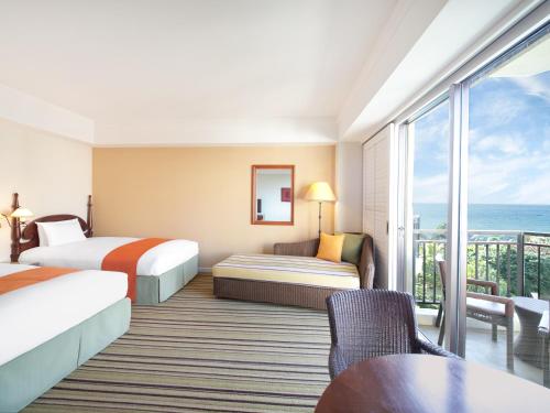 Postel nebo postele na pokoji v ubytování Hotel Nikko Alivila