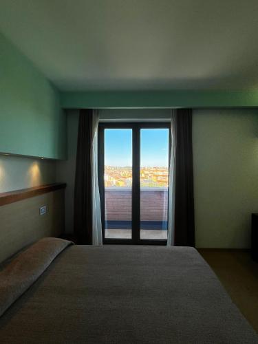 Postel nebo postele na pokoji v ubytování don guglielmo panoramic hotel & spa