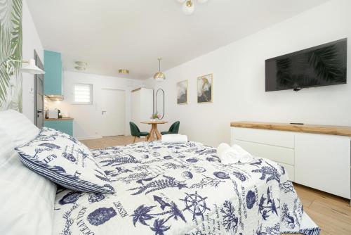 Postel nebo postele na pokoji v ubytování Akwamaryn Apartamenty