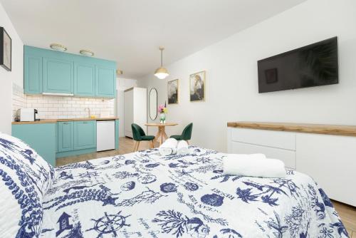 Kuchyň nebo kuchyňský kout v ubytování Akwamaryn Apartamenty