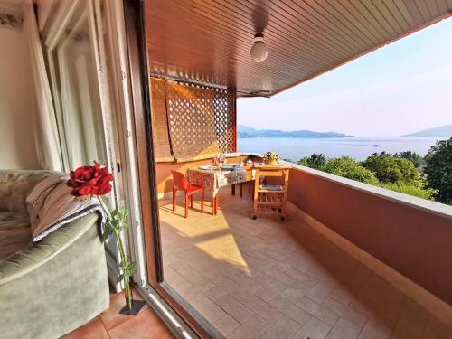a balcony with a table and a view of the ocean at Selva Salvia in Cissano