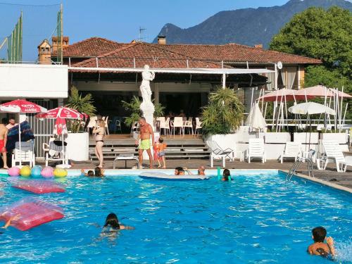 a group of people swimming in a swimming pool at Selva Salvia in Cissano
