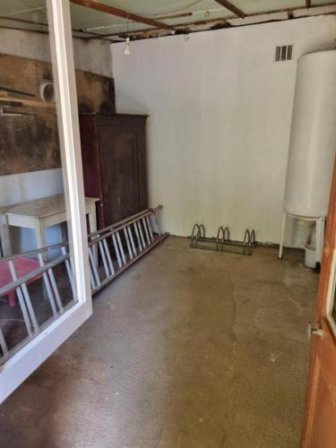 an empty room with a door open to a room with a room at La Villa Bois Joli HOTEL RESTAURANT in Bagnoles de l'Orne