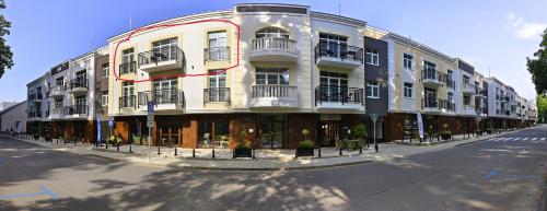 a large building on the side of a street at Apartmán Verdi in Turčianske Teplice