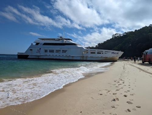 a cruise ship is docked on the beach at Villa 36 Tangalooma in Tangalooma