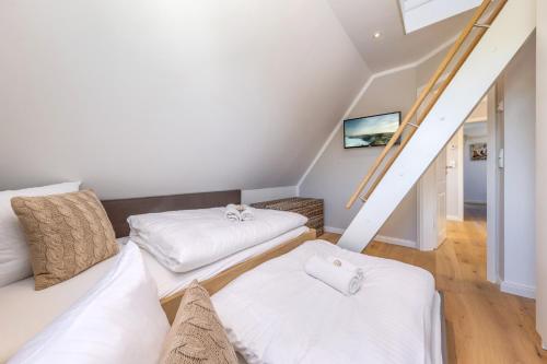 Ένα ή περισσότερα κρεβάτια σε δωμάτιο στο Ferienhaus Strandkajüte