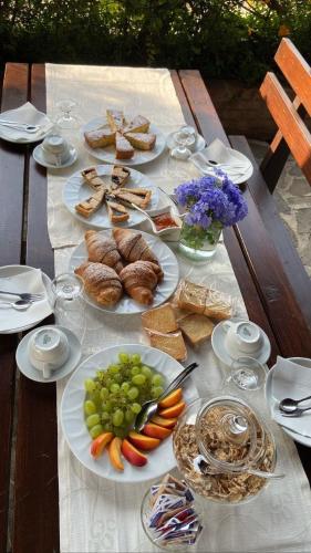 a table with plates of food on top of it at Agriturismo San Basilio in Salento