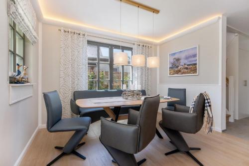 Μια τηλεόραση ή/και κέντρο ψυχαγωγίας στο Ferienhaus Strandkajüte